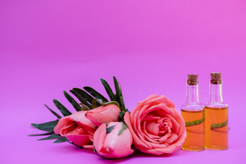 Essential oil in bottles extracted from rose
