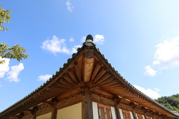 Korean traditional house roof and blue sky. Mooseom folk village, Youngju, South Korea
