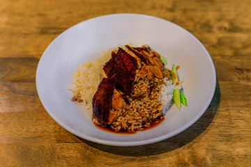Slices of traditional Chinese Roast with crispy skin served at a Chinese restaurant
