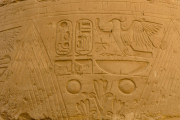 Egyptian ancient hieroglyphs on the stone wall