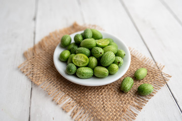 Freshly harvested cucamelons, Mexican sour gherkin pepquino or mouse melon. Sour grape size cucumbers. 