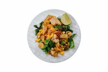 Fried big noodle with pork and Chinese kale with ingredients, Thai cooking and restaurant food
