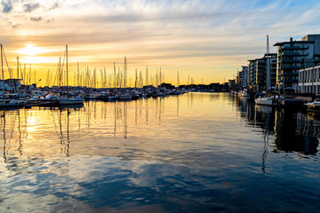 Obraz premium Sunset in Harbour full of sailboats in Helsingborg, Sweden. Summer in Southern Sweden concept