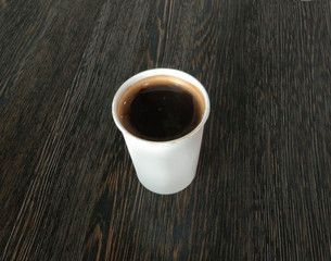 Hot Black coffee in white paper cup 