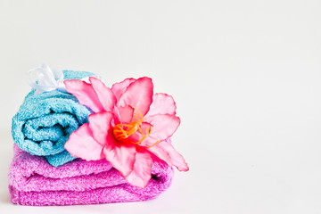 spa still life - a flowers and towels on a wooden background,Place for text