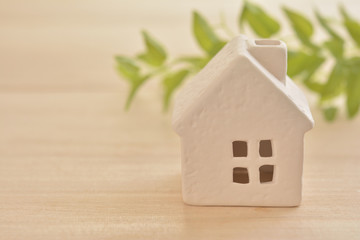 White house on a wood desk