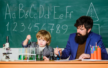 biotechnology research concept. Wisdom. Back to school. son and father at school. Formula. experiments in organic chemistry laboratory. small boy with teacher man. Like oxygen is to live.