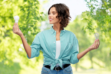 eco living, inspiration and sustainability concept - portrait of happy smiling young woman in...