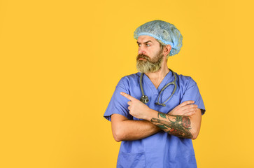 pediatrician intern. Health care and cure. copy space. brutal bearded man pointing finger. best...