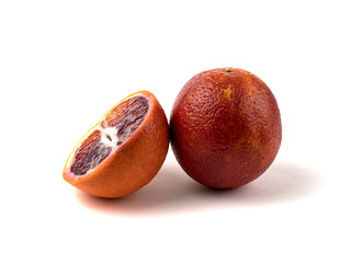 Fresh blood orange with soft shadow isolated on a white background side view