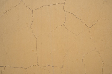 Background image of the texture of a painted cracked wall