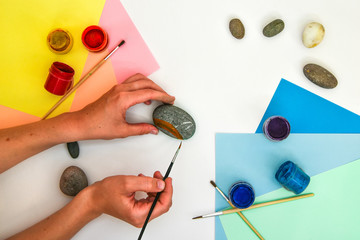 How to draw a rainbow on a stone step by step. Children art project. DIY concept. Step by step...