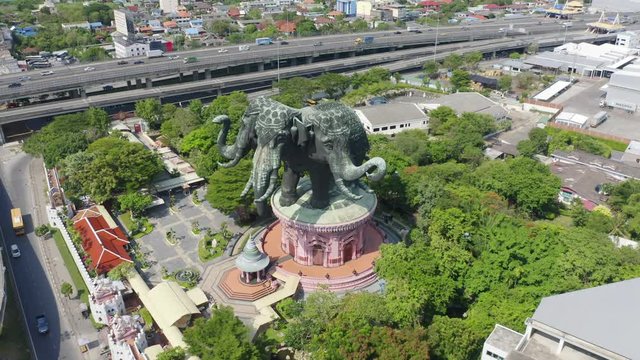 Aerial view of Erawan Museum is a Elephant head sculpture with 3 heads. Tourist attraction of Samut Prakan district with Downtown Bangkok. Urban city at noon, Thailand. Thai landmark architecture.