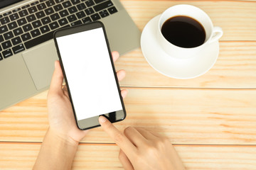 hand of women using smartphone and working in home office with coffee