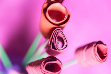 Paper red roses flower bouquet art craft on a pink background