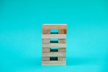 Image of blocks wood game to growing up of business. Risk of management and strategy plan