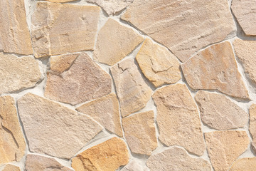 the wall is lined with plates of natural stone