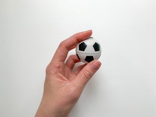 hand holding soccer ball