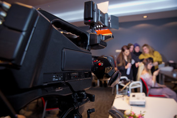 Makeup cosmetic at home. Focus on tripod mounted Video camera screen showing . In front of the camera to recording vlog video live streaming at home.Business online influencer on social media concept.