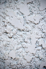 The wall surface of the house is made of cement.