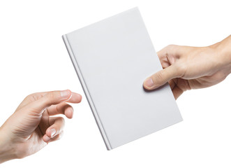 Obraz premium Hands sharing blank book, isolated on white background