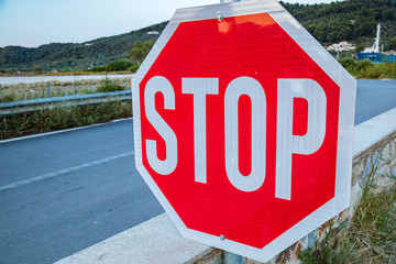 Stop sign on a suburb empty road.