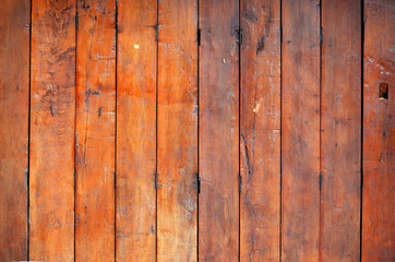 The walls of the house are built with wood.