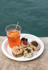 Cicchetti and Aperol Spritz traditional venetian food and drink.