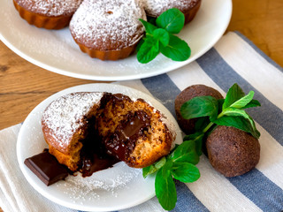 cupcake with chocolate filling on a white plate. Sliced ​​Cupcake.