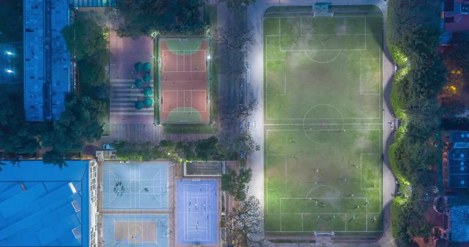 Aerial hyperlapse of bird's eye view from sports courts with people playing