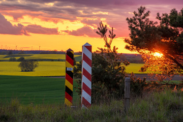 The Polish-German state border. Border posts on the border during sunset