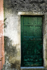 typical wooden door of a small town in Liguria, Italy