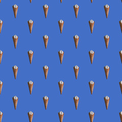 Seamless pattern of ice cream cone, blue background. wrapping paper template