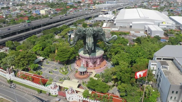 Aerial view of Erawan Museum is a Elephant head sculpture with 3 heads. Tourist attraction of Samut Prakan district with Downtown Bangkok. Urban city at noon, Thailand. Thai landmark architecture.