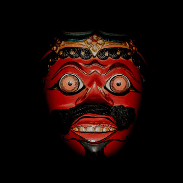 red mask on black background for topeng dance in majalengka, Indonesia