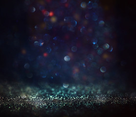 Obraz premium background of abstract glitter lights. blue and black. de focused
