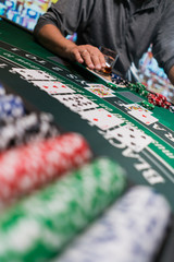 Fototapeta premium Man playing BlackJack at the casino
