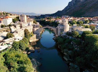 Stari Most Bridge Over River In Town By Mountains