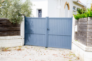 gray gate of the detached house in suburb