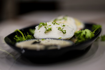 idli garland with fresh cut coriander .