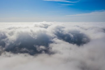 Fototapeta na wymiar Flying in the sky over the clouds.