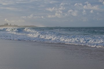 Surfer catching waves on the Sunshine Coast in Australia.