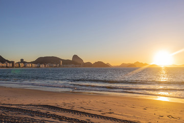 sunrise at Copacabana beach in Rio de Janeiro.