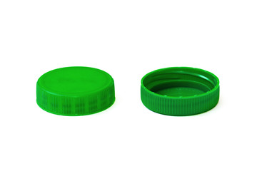 Green plastic lids on a white background close-up. Environmental pollution with plastic. Plastic...