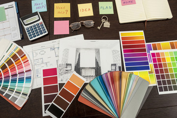 Design home renovation.  house plan composition and brushes with color palette on table.
