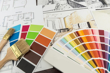 Design home renovation.  house plan composition and brushes with color palette on table.