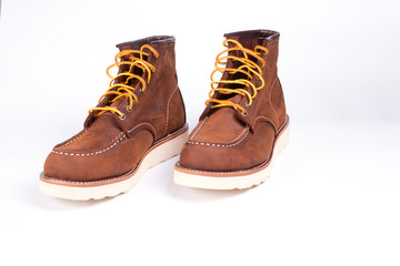 Brown boot on white background.