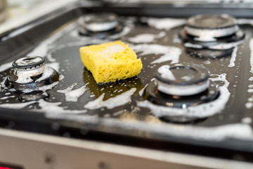 Sponge and white foam all for cleaning black glass ceramic surface