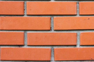 Glossy Orange Brick Wall