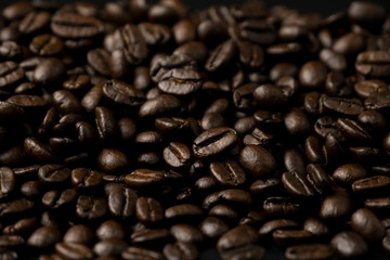 Pile of roasted coffee beans splash on the floor